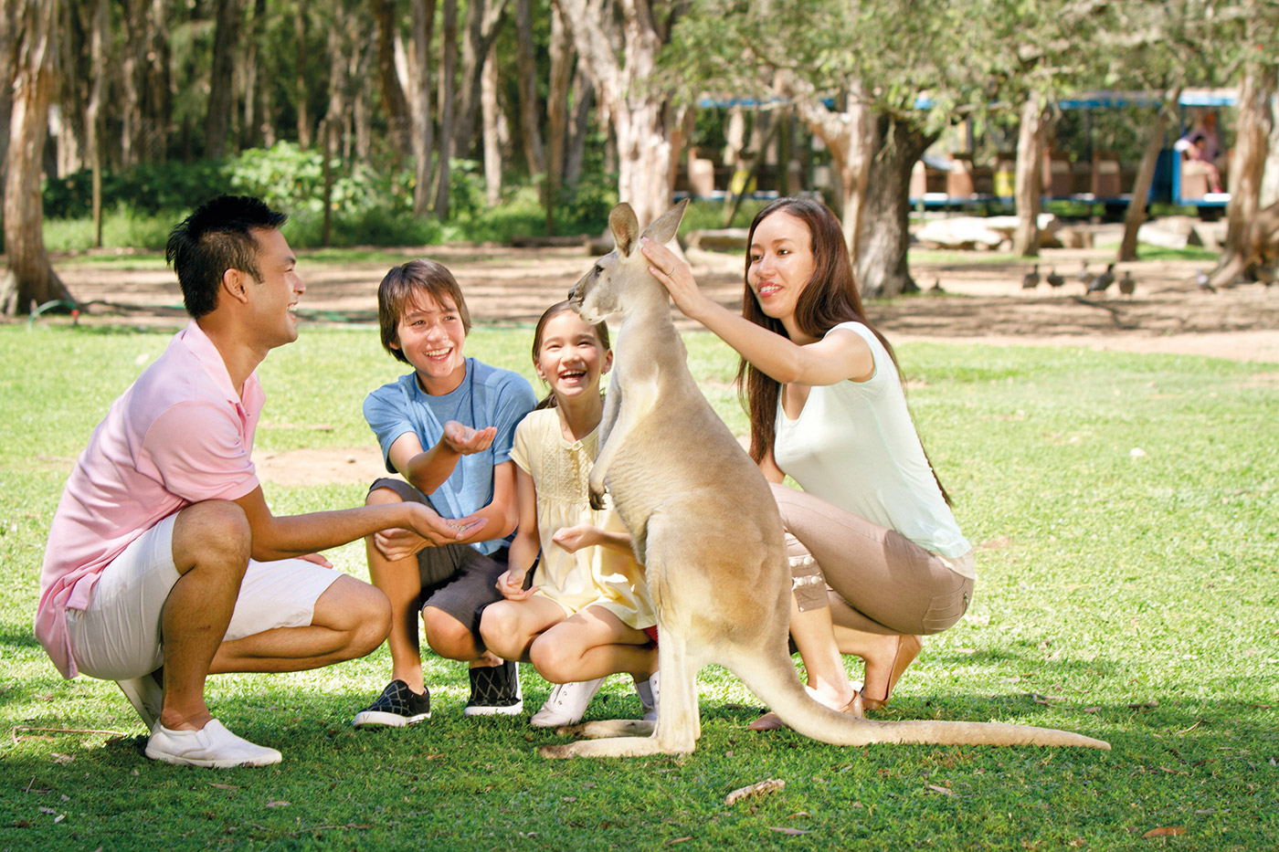 Family with kangaroo, Currumbin Wildlife Sanctuary | Courtesy of Tourism and Events Queensland | Photo Credit: Paul Giggle